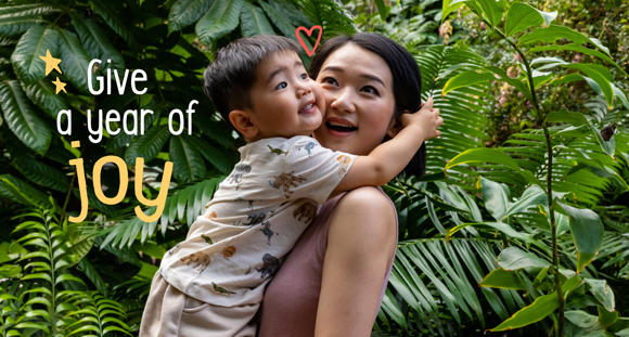 "Give a year of joy": A young guest embraces his mother in the Butterfly House.