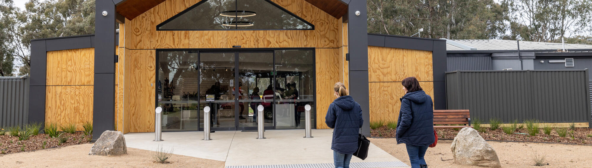 Two women walking into the Entrance of Kyabram Fauna Park.